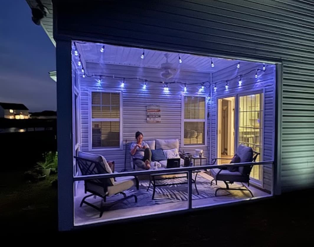 Screened porch with string lights at night — Eastern NC